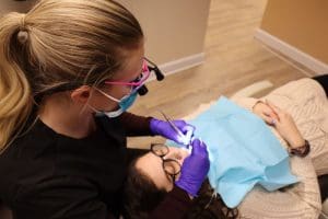 Dentist performing treatment Dental Special Offers in Bethesda A dentist performing treatment at Pike district Smiles. Dental Special Offers in Bethesda