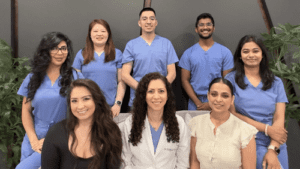 Pike District Smiles doctors team. The best dentists and dental services hub A professional team of dentists and helping staff posing for beautiful picture at Pike District Smiles. The best dentists and dental services place