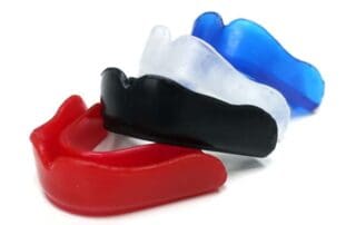 Colorful mouth guards displayed on a table at Unique Dental of Framingham.